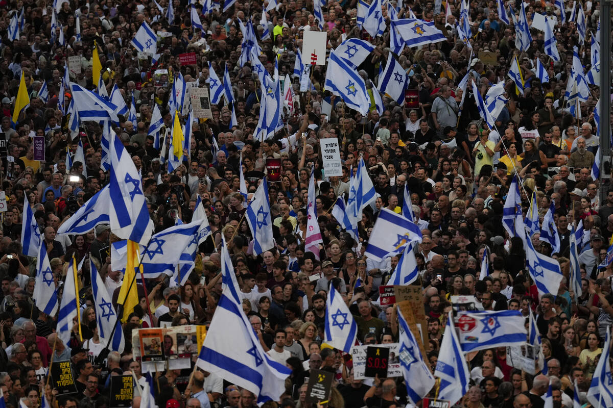 People take part in a protest calling for a deal for immediate release of hostages held in the ...