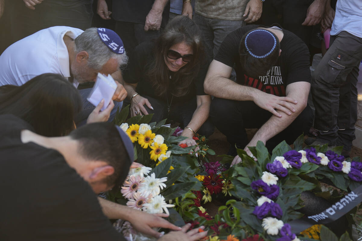 Nira Sarusi, center, mourns during the funeral of her son, slain hostage Almog Sarusi, who was ...