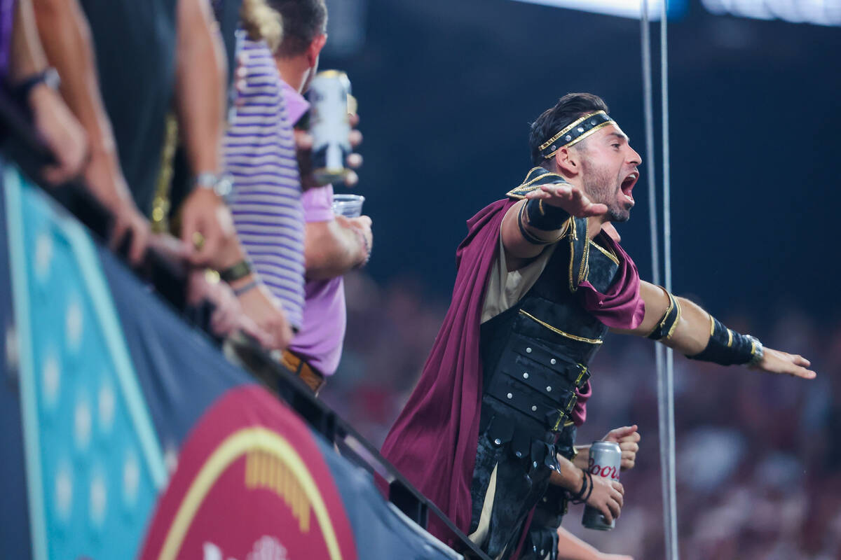 A Southern California fan screams to a referee during the Vegas Kickoff Classic NCAA football g ...