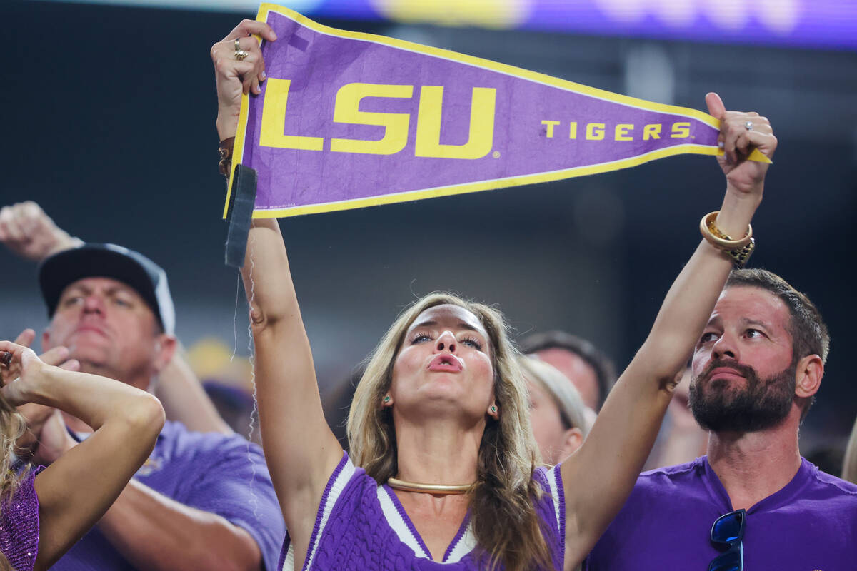 An LSU fan cheers during the Vegas Kickoff Classic NCAA football game between LSU and Southern ...