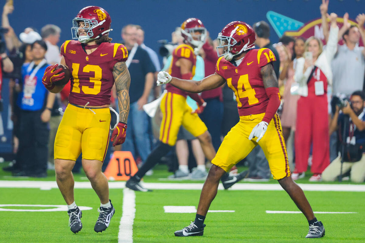 Southern California linebacker Mason Cobb (13) celebrates intercepting the ball from LSU with t ...