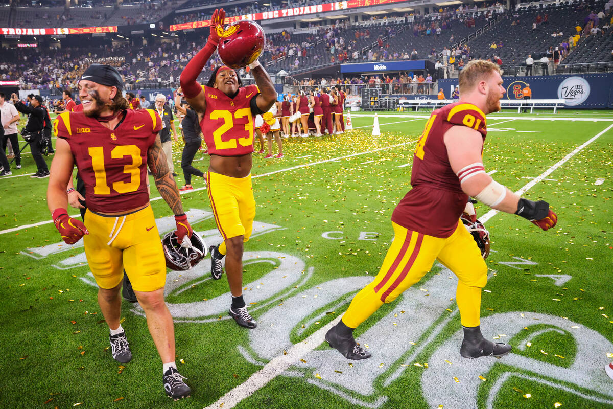 Southern California players celebrate winning the Vegas Kickoff Classic NCAA football game betw ...