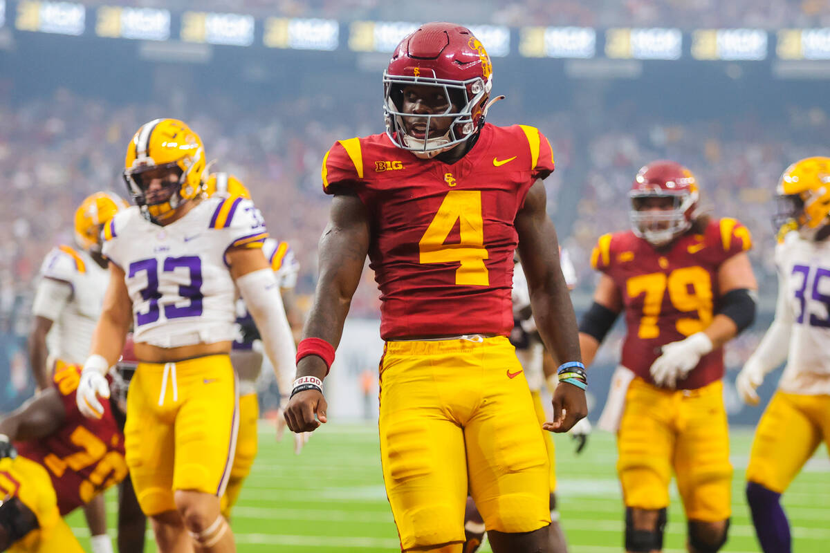 Southern California running back Woody Marks (4) celebrates a touchdown during the Vegas Kickof ...