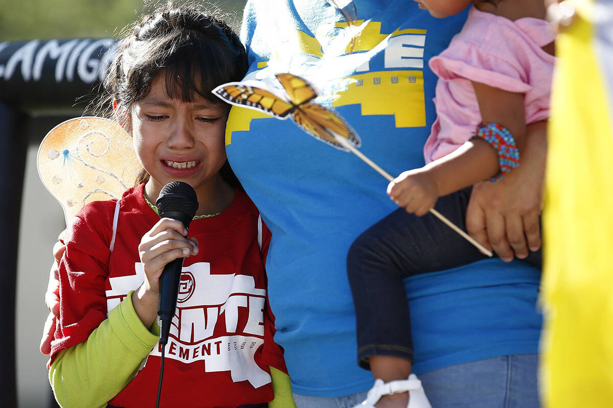 Akemi Vargas, 8, cries as she talks about being separated from her father during an immigration ...