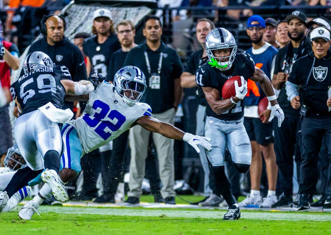 Raiders wide receiver Tre Tucker (11) breaks free past Dallas Cowboys running back Snoop Conner ...