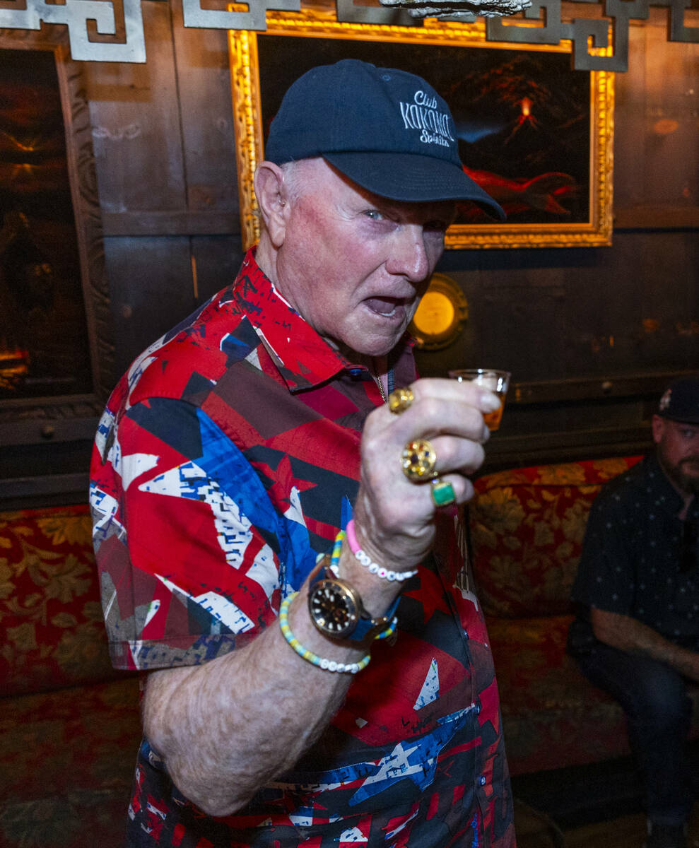 Beach Boys legend Mike Love, center, has a shot of his Club Kokomo Spirits rum before receivin ...