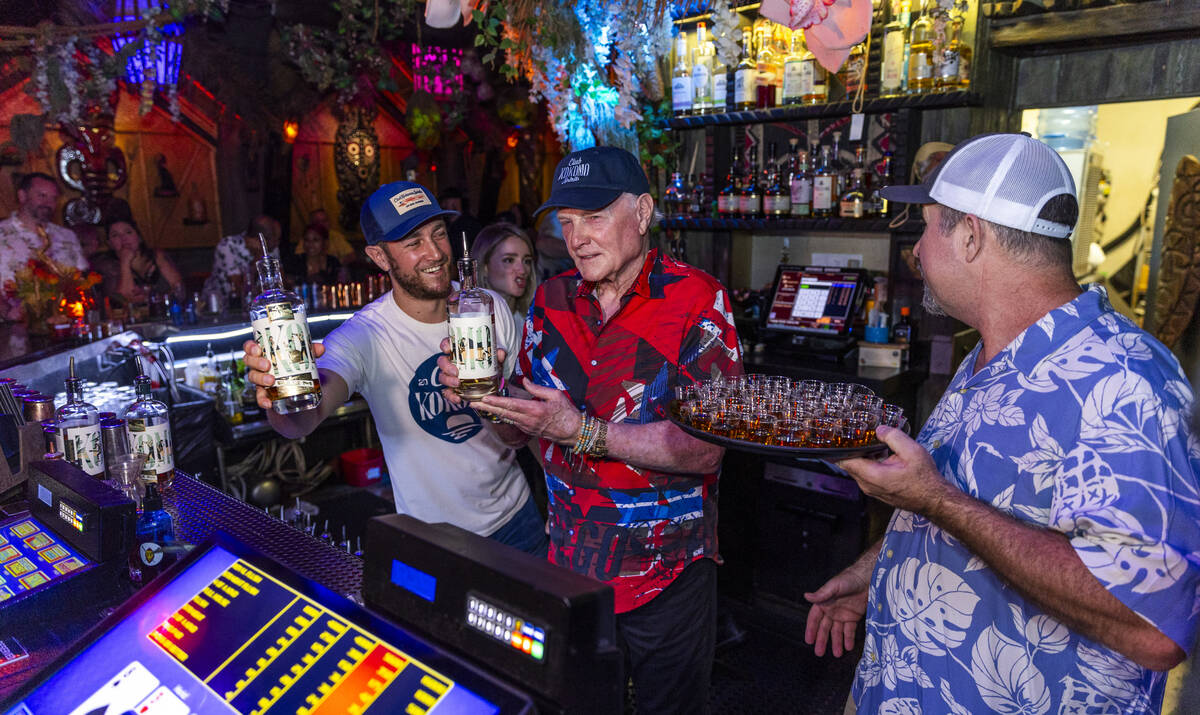 Beach Boys legend Mike Love, center, Brian, left, and Mike Jr., after pouring some of their Clu ...