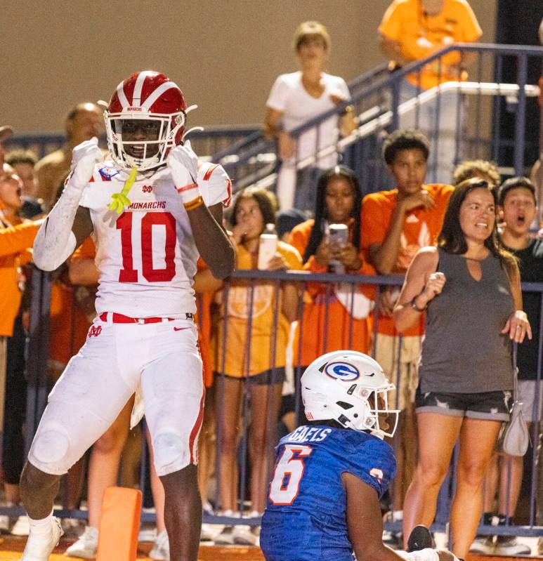 Mater Dei's wide receiver Marcus Harris (10) celebrates his touchdown as Bishop Gorman's defen ...