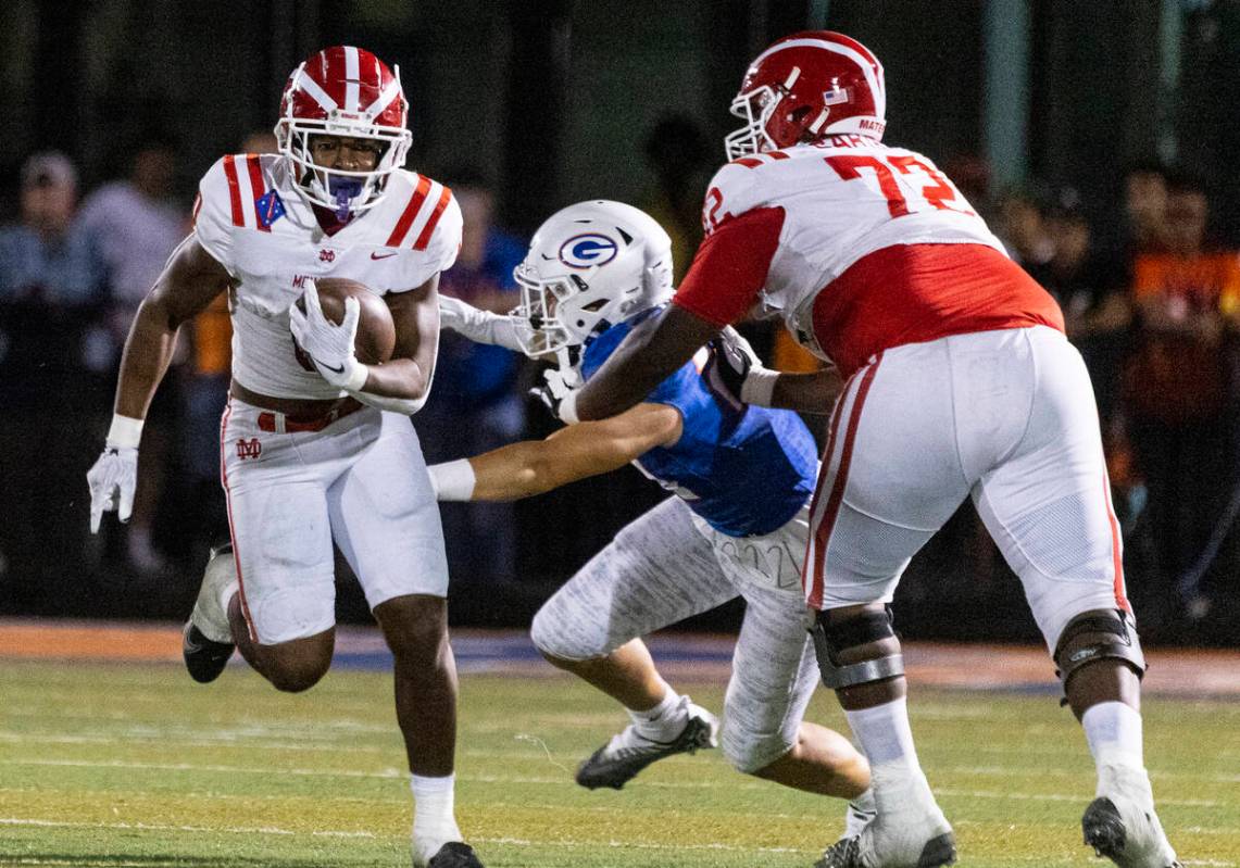 Mater Dei's running back Jordon Davison (0) runs with the ball against Bishop Gorman during the ...