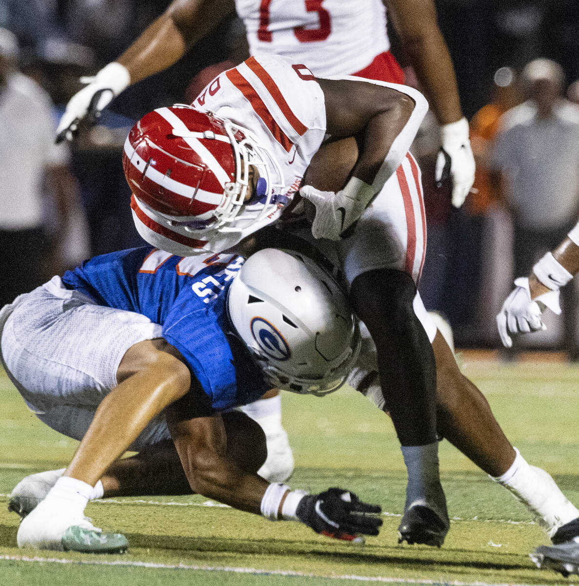 Bishop Gorman's defensive back Justyn Rhett (2) tries to take down Mater Dei's running back Jor ...