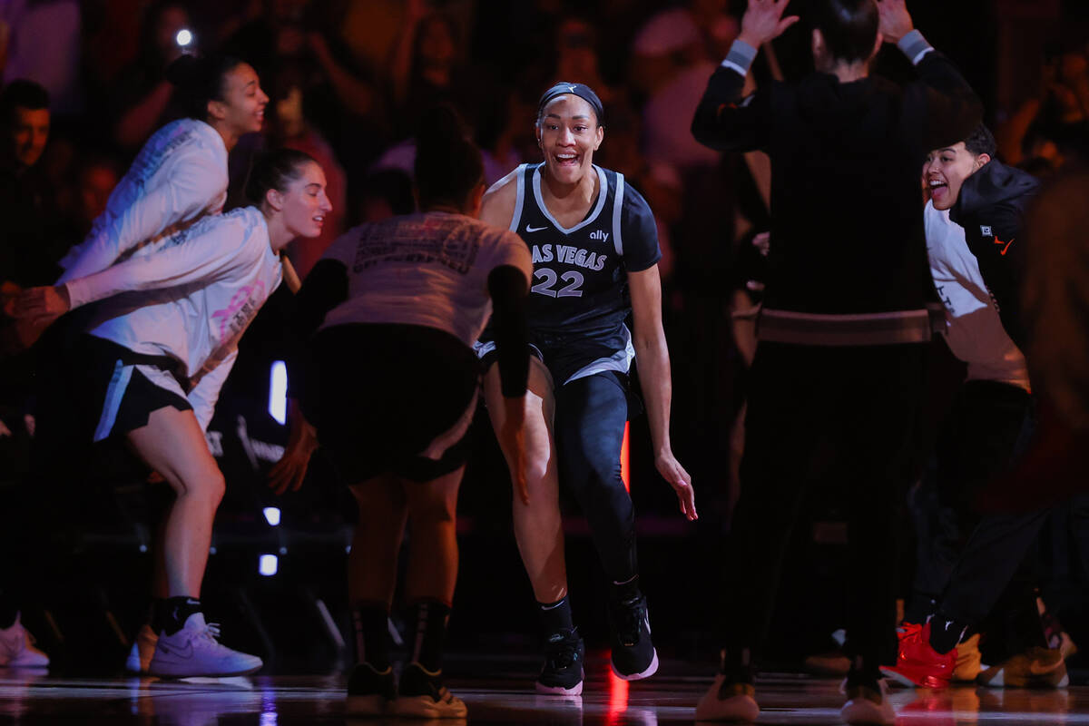 Aces center A'ja Wilson makes her way onto the court for introductions during a WNBA basketball ...