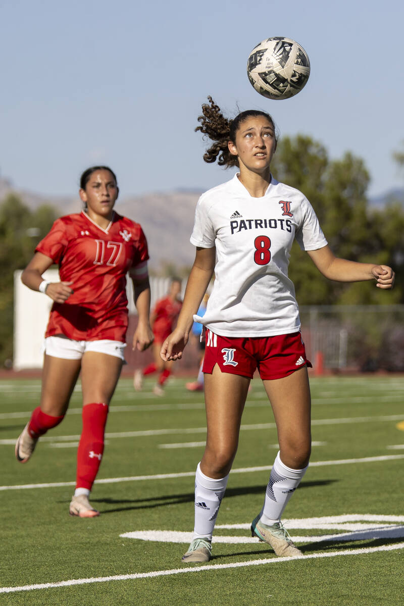 Liberty junior Amira Walker (8) receives the ball during the high school girls soccer match aga ...