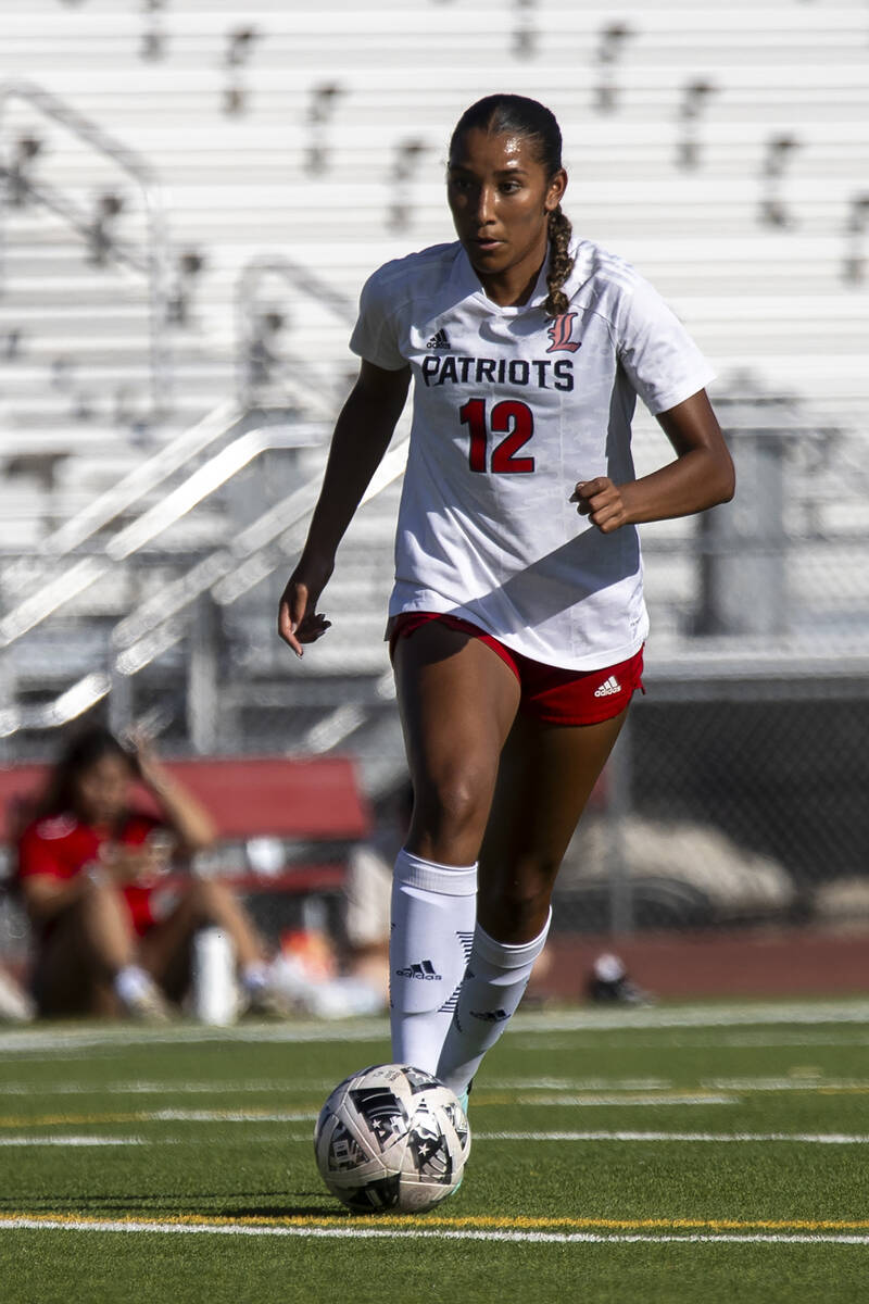 Liberty junior Ayva Jordan (12) competes during the high school girls soccer match against Arbo ...