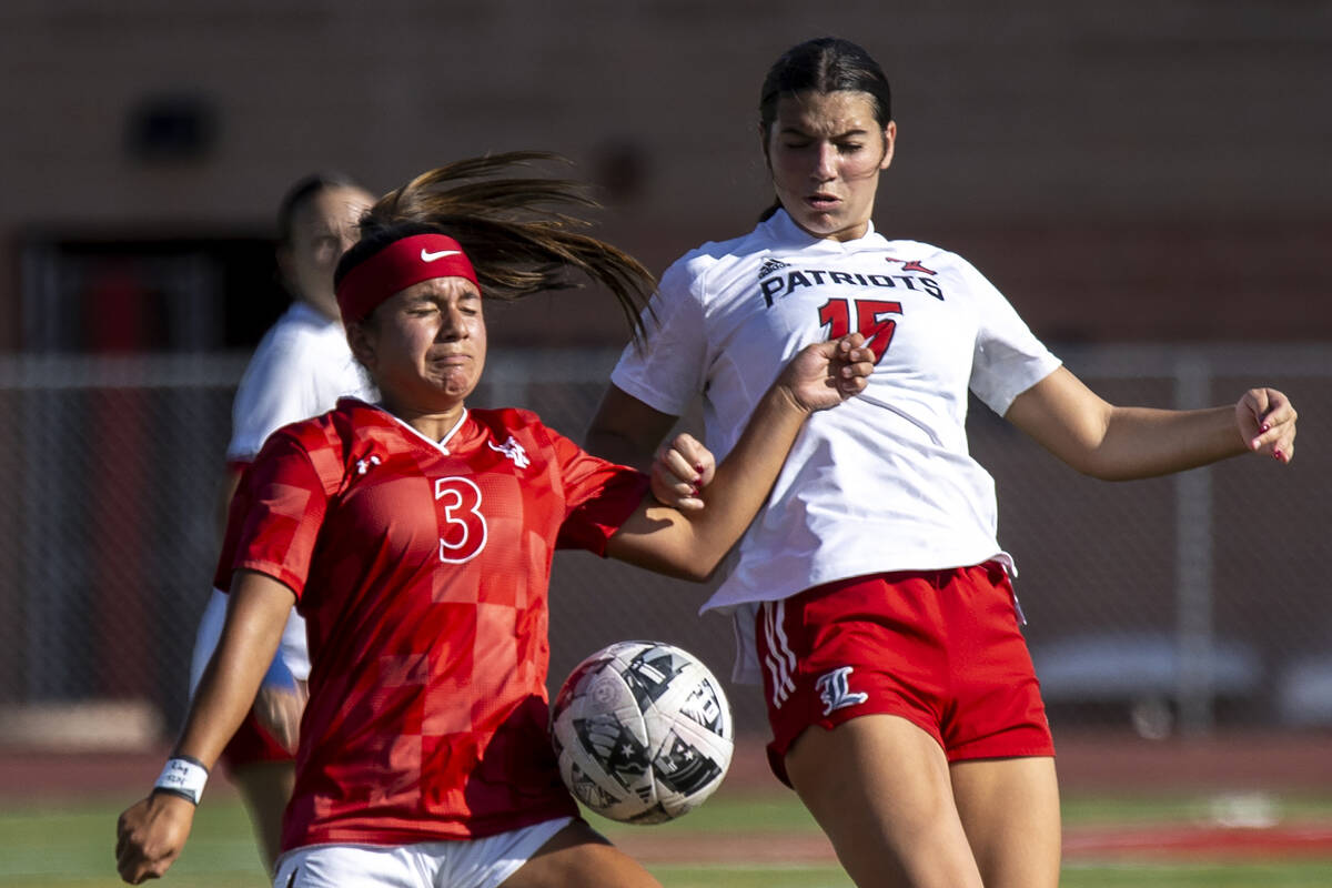 Arbor View sophomore Danielle Morales (3) and Liberty defender Ava Hutt (15) compete during the ...