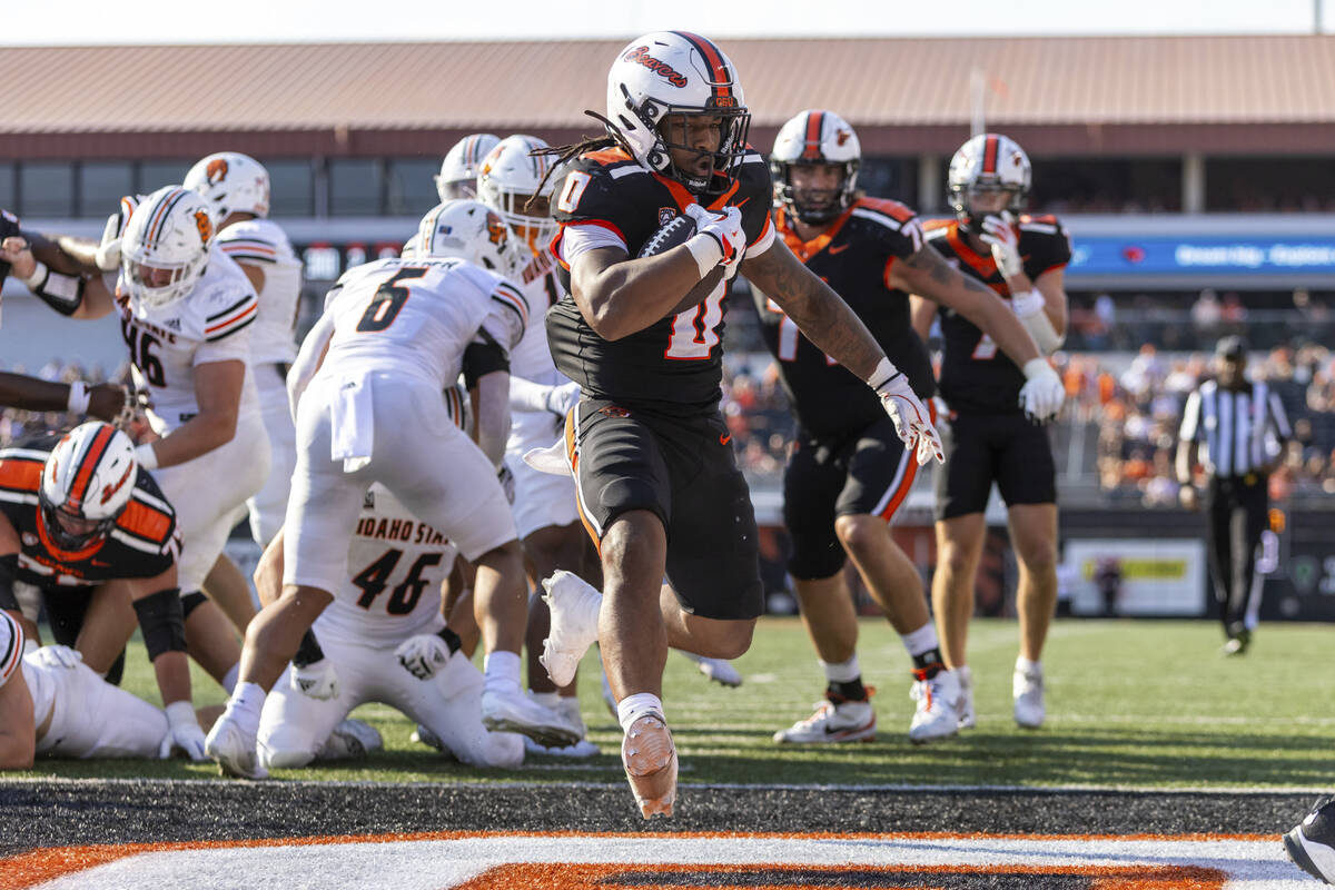 Oregon State running back Anthony Hankerson (0) finds the end zone for a touchdown during an NC ...