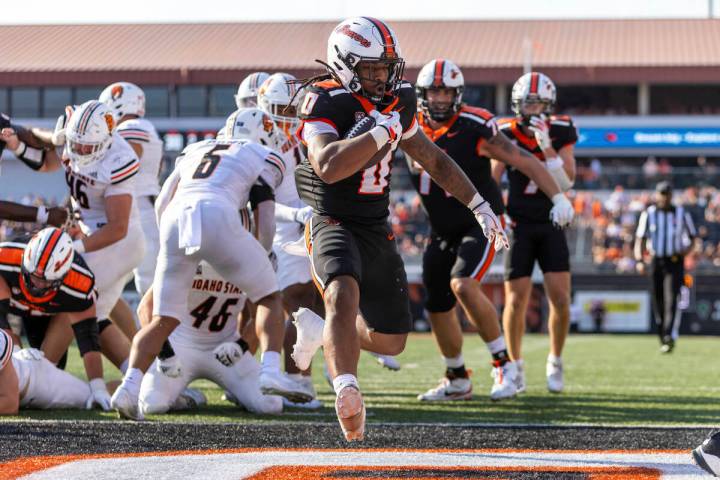 Oregon State running back Anthony Hankerson (0) finds the end zone for a touchdown during an NC ...