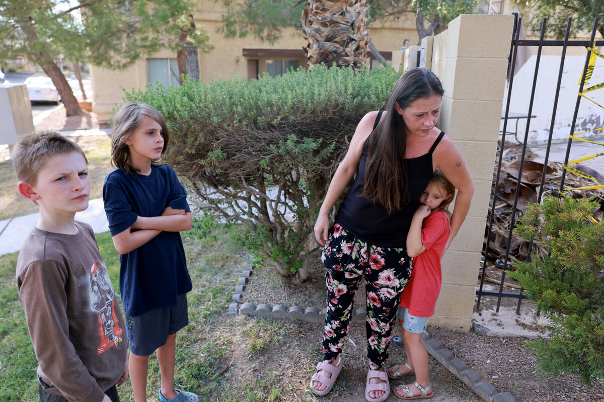 Amanda Ahlstrom, who owns a unit at Somerset Park townhouse complex in Henderson, hangs out wit ...