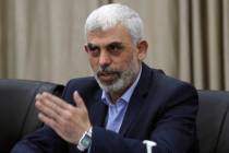 Yahya Sinwar, head of Hamas in Gaza, greets his supporters during a meeting with leaders of Pal ...