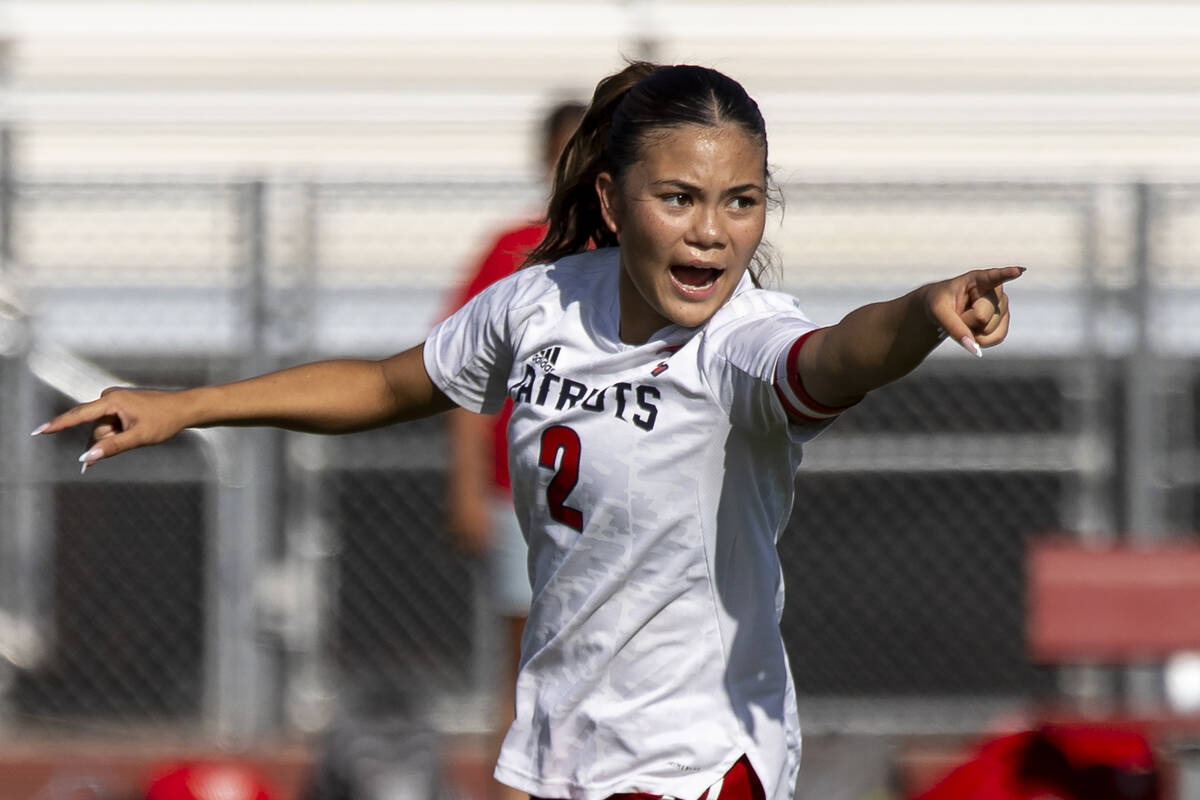 Liberty senior Natalie Collins (2) directs her teammates during the high school girls soccer ma ...