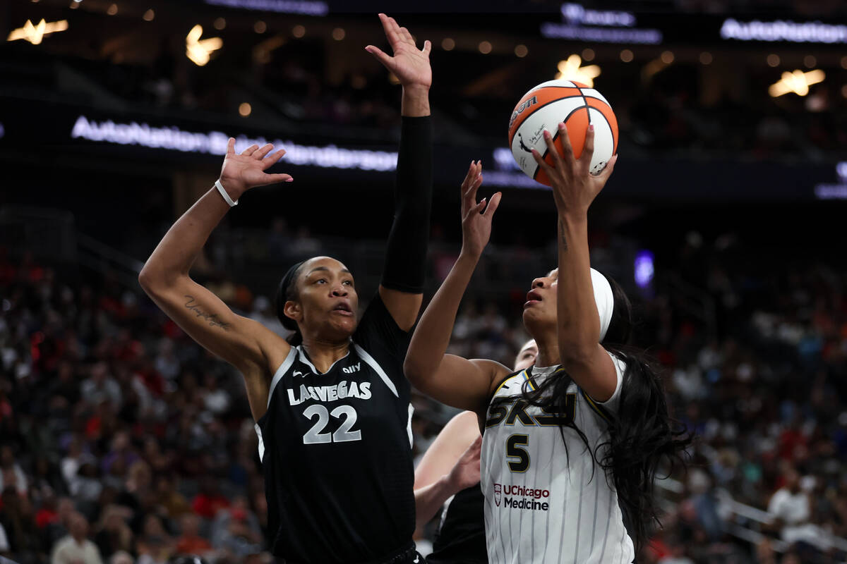 Chicago Sky forward Angel Reese (5) shoots against Las Vegas Aces center A'ja Wilson (22) durin ...