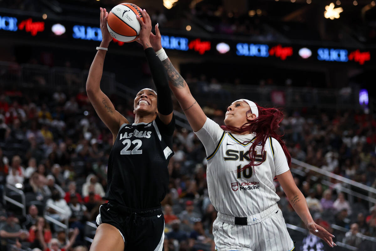 Las Vegas Aces center A'ja Wilson (22) shoots and is fouled by Chicago Sky center Kamilla Cardo ...