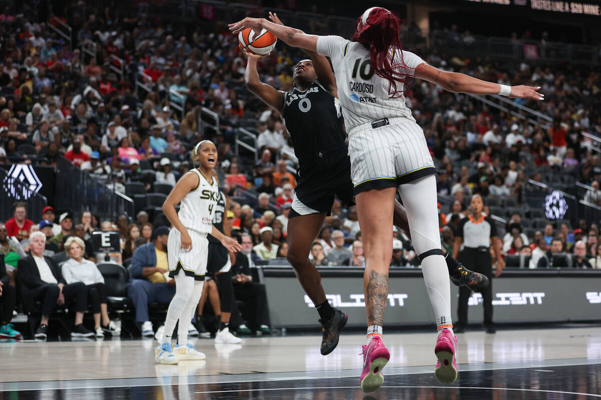 Las Vegas Aces guard Jackie Young (0) shoots against Chicago Sky center Kamilla Cardoso (10) du ...