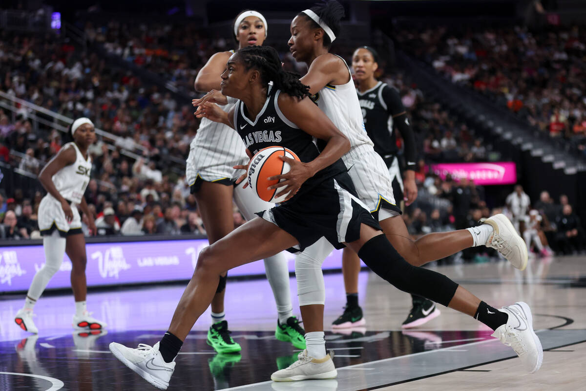 Las Vegas Aces guard Tiffany Hayes (15) drives toward the hoop against Chicago Sky forward Ange ...