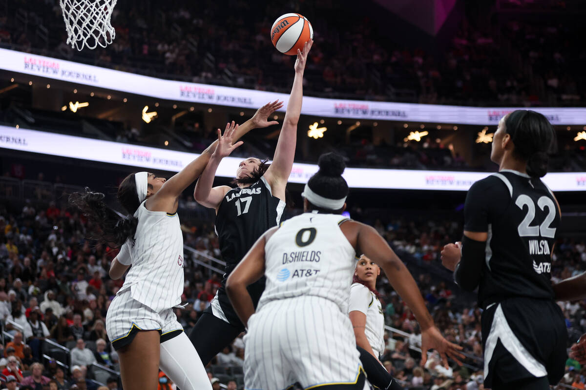 Las Vegas Aces center Megan Gustafson (17) shoots and is fouled by Chicago Sky forward Angel Re ...