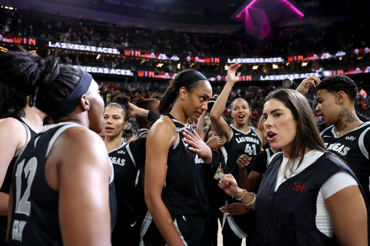 The Las Vegas Aces gather after winning a WNBA basketball game against the Chicago Sky at T-Mob ...