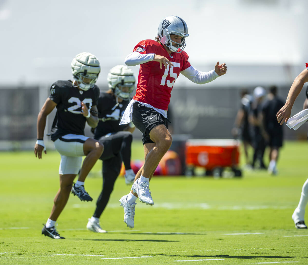 Raiders quarterback Gardner Minshew (15) catches some air during a drill in practice at the Int ...