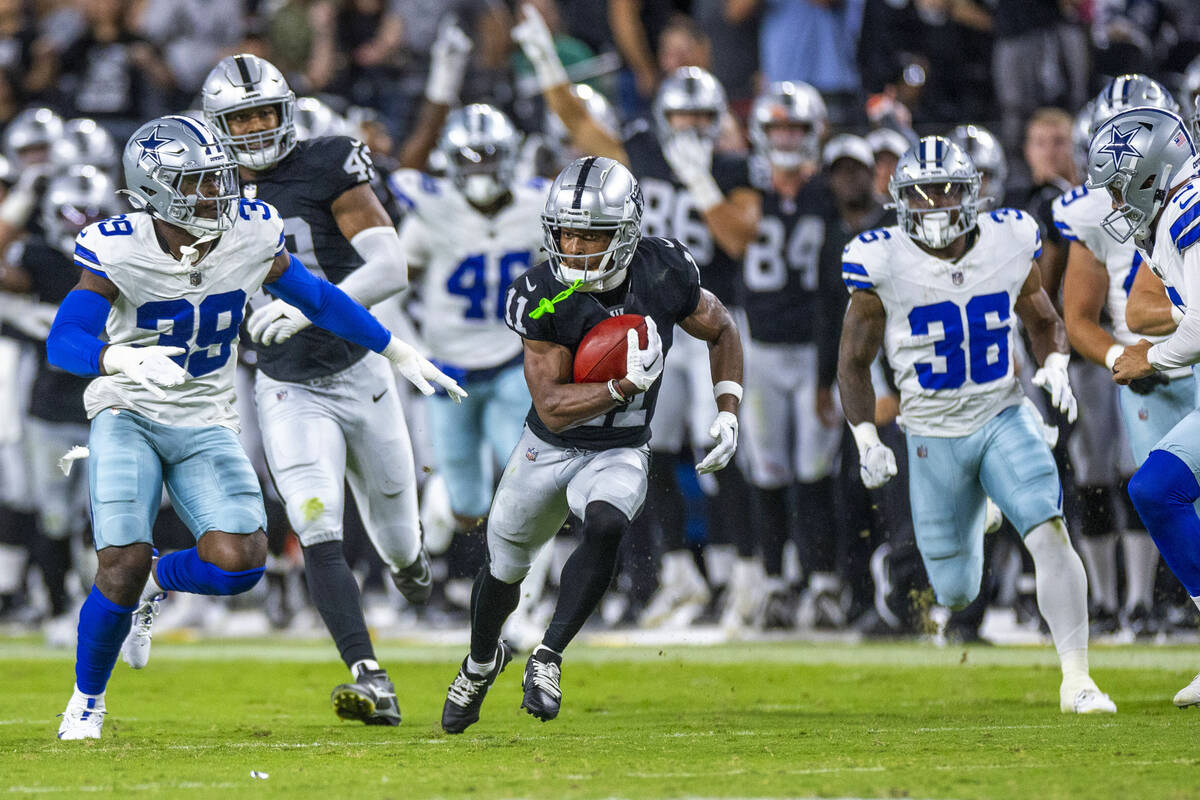 Raiders wide receiver Tre Tucker (11) makes a big kickoff return against the Dallas Cowboys dur ...