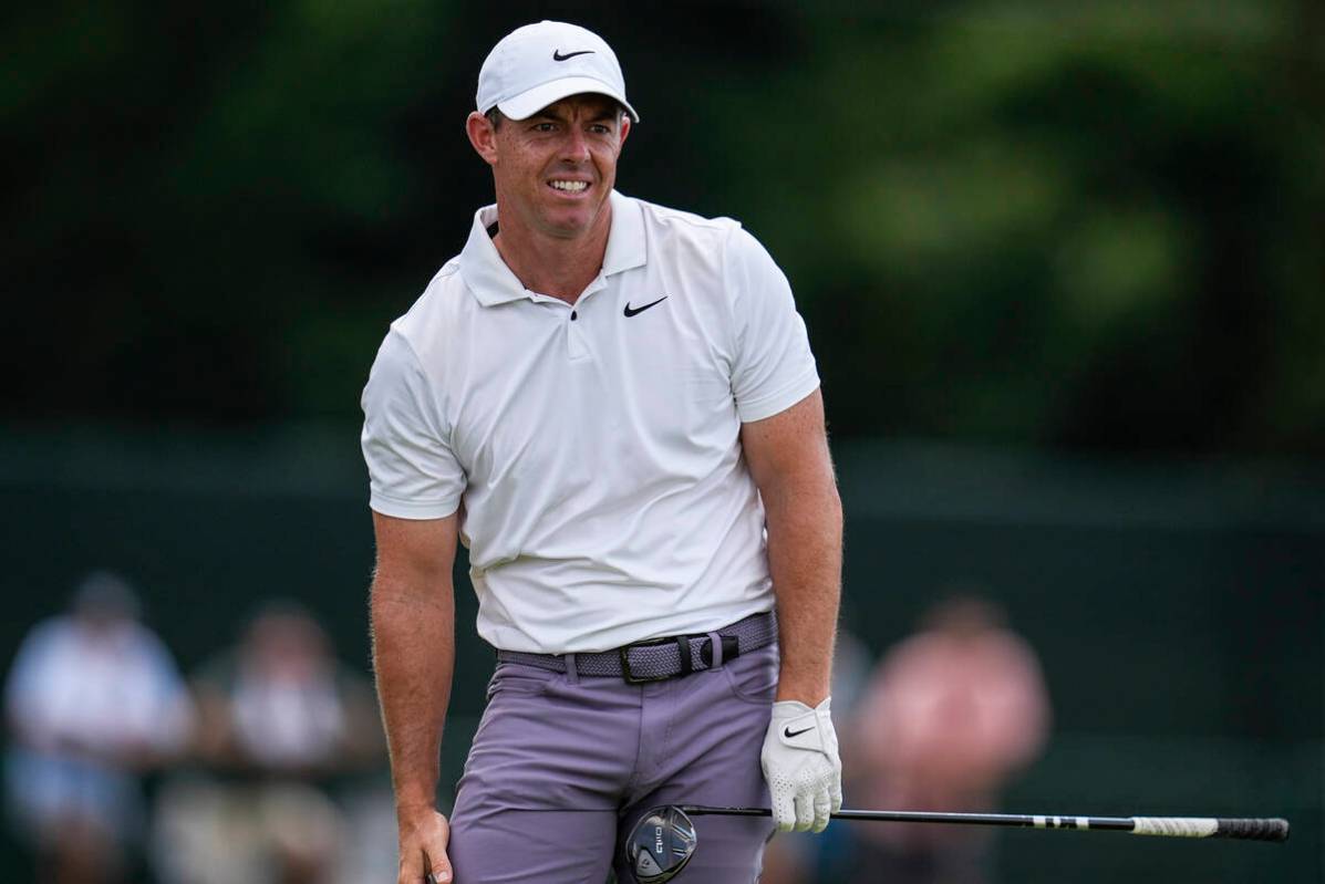 Rory McIlroy, of Northern Ireland, watches his ball on the eighth hole during the second round ...