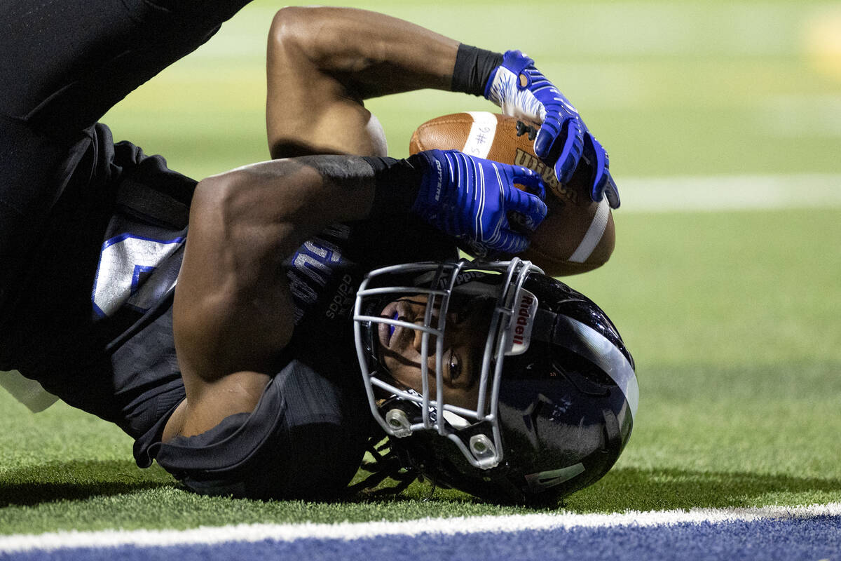 Desert Pines’ Quinten Larry (16) goes down with the ball but barely misses the end zone durin ...