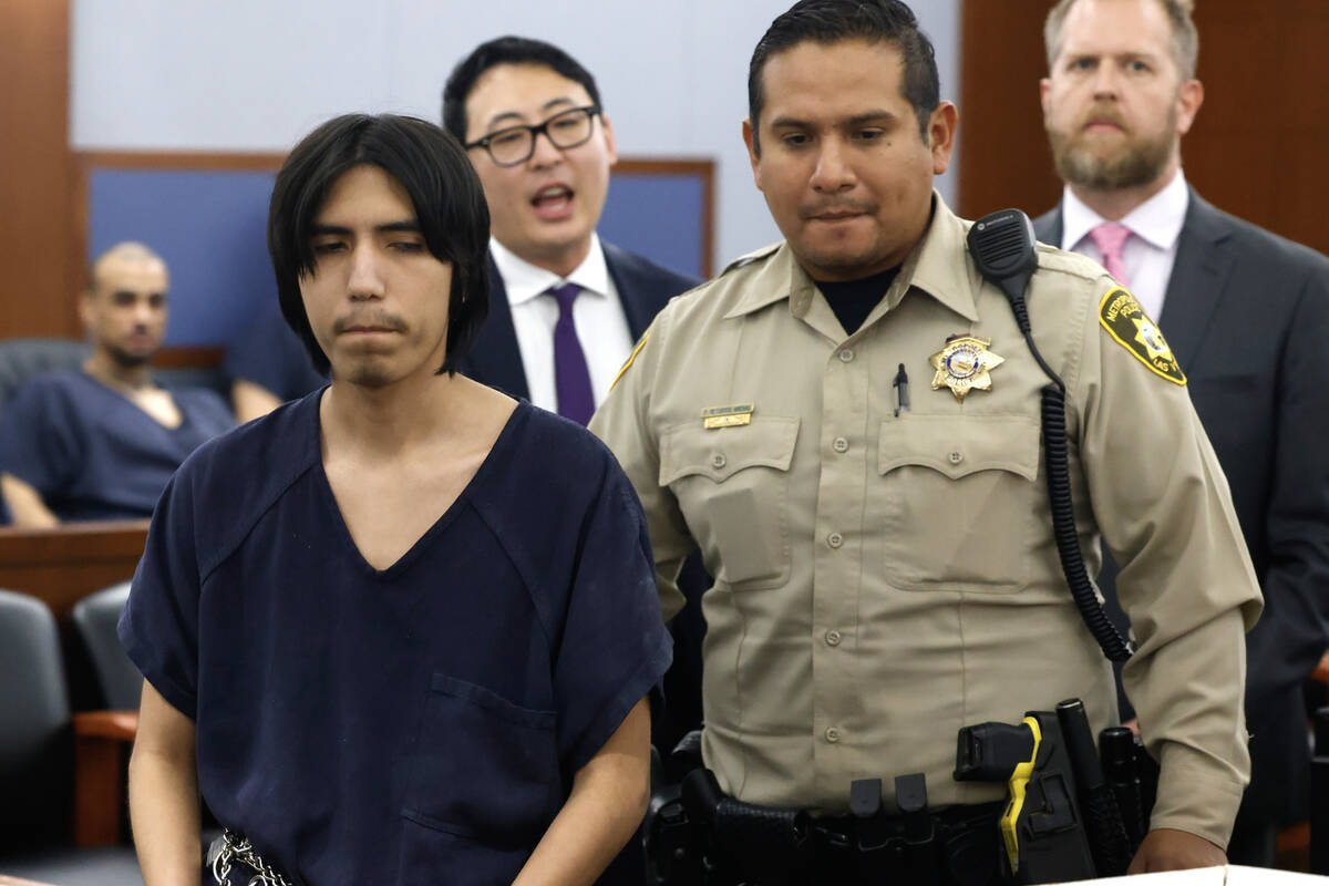 Joshua Robles, who is facing terrorism-related charges, is led out of a courtroom after a bail ...