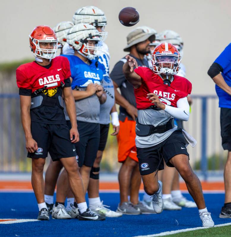 Bishop Gorman quarterback Melvin Spicer IV (#2) tosses an out pass during football practice on ...