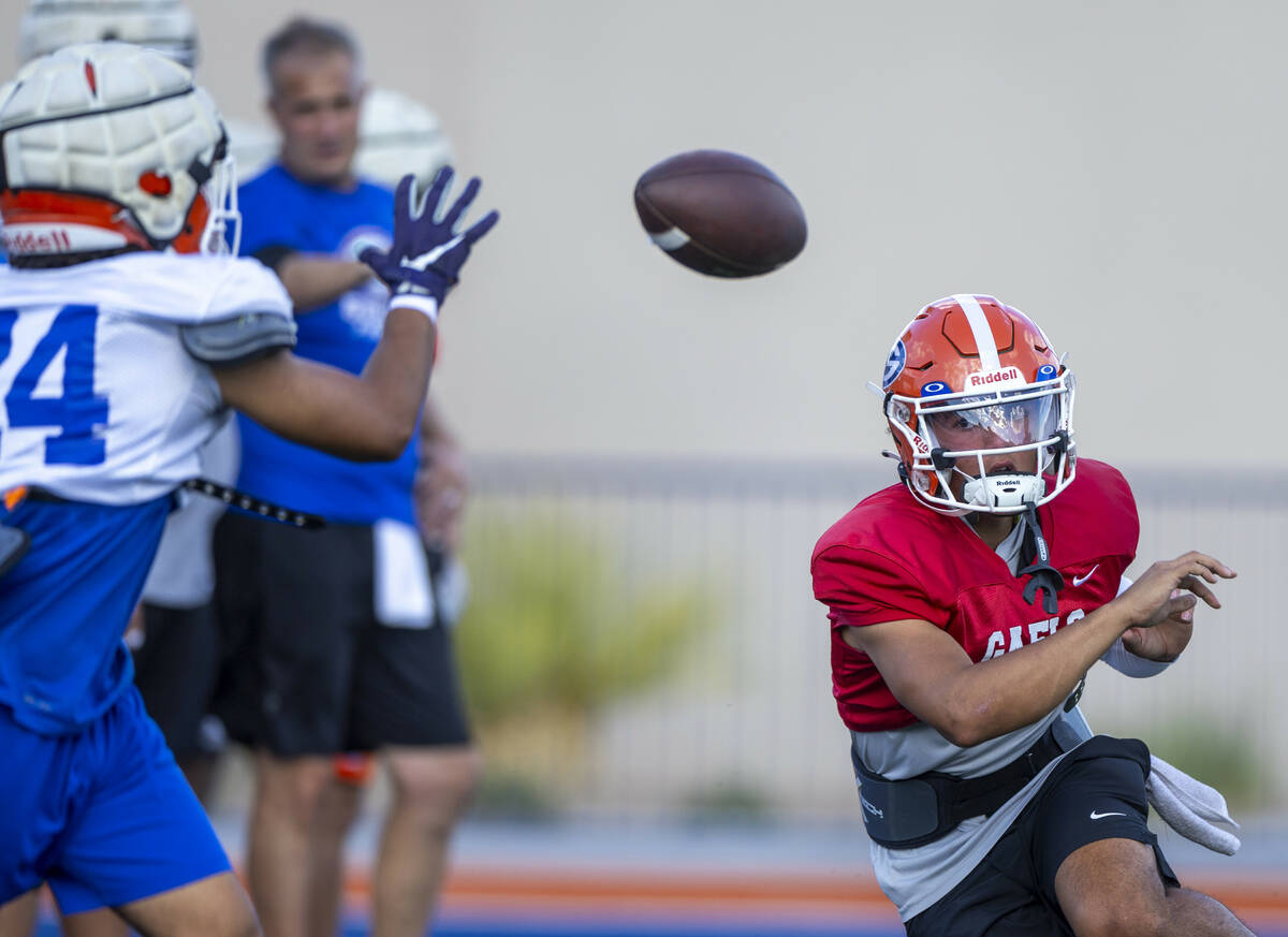 Bishop Gorman quarterback Melvin Spicer IV (#2) laterals the ball to running back Myles Norman ...