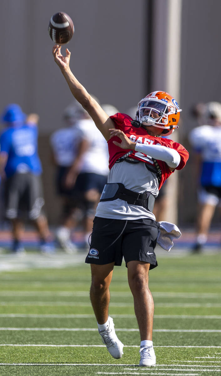 Bishop Gorman quarterback Melvin Spicer IV (#2) throws a long pass during football practice on ...