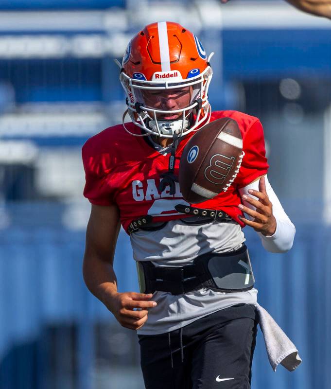 Bishop Gorman quarterback Melvin Spicer IV (#2) tosses a ball during football practice on Tuesd ...