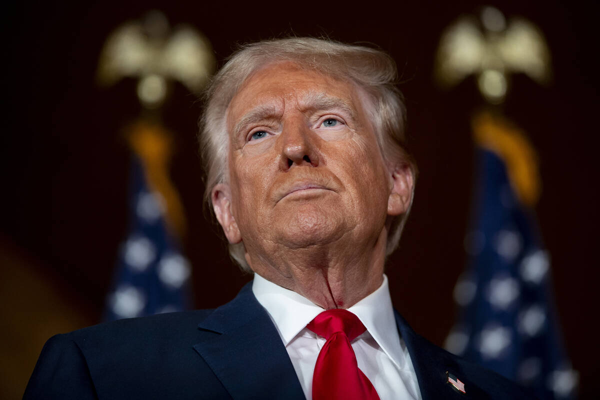 Former President Donald Trump is questioned by the media at Il Toro E La Capra, Friday, Aug. 23 ...