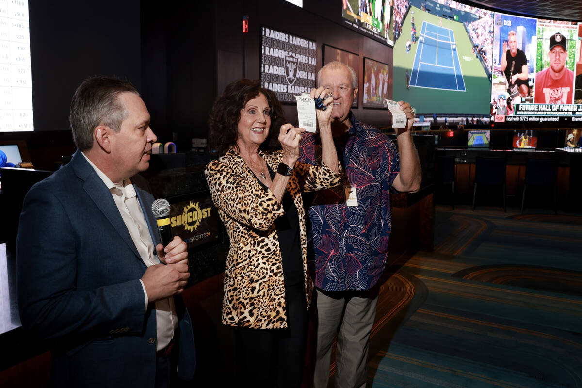 Cindy Ono and her husband Terry Ono of Las Vegas shows the first bets at the new Suncoast sport ...