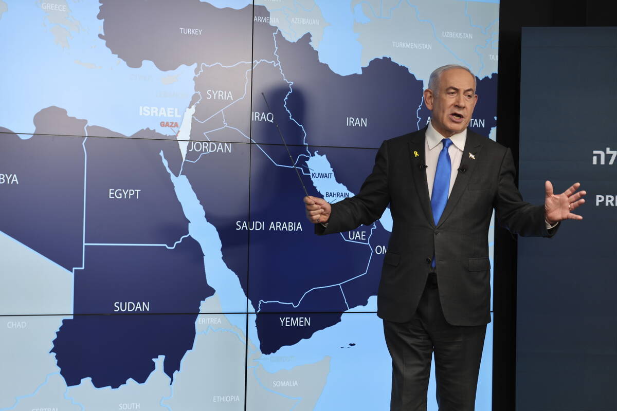 Israeli Prime Minister Benjamin Netanyahu stands before a map during a press conference at the ...