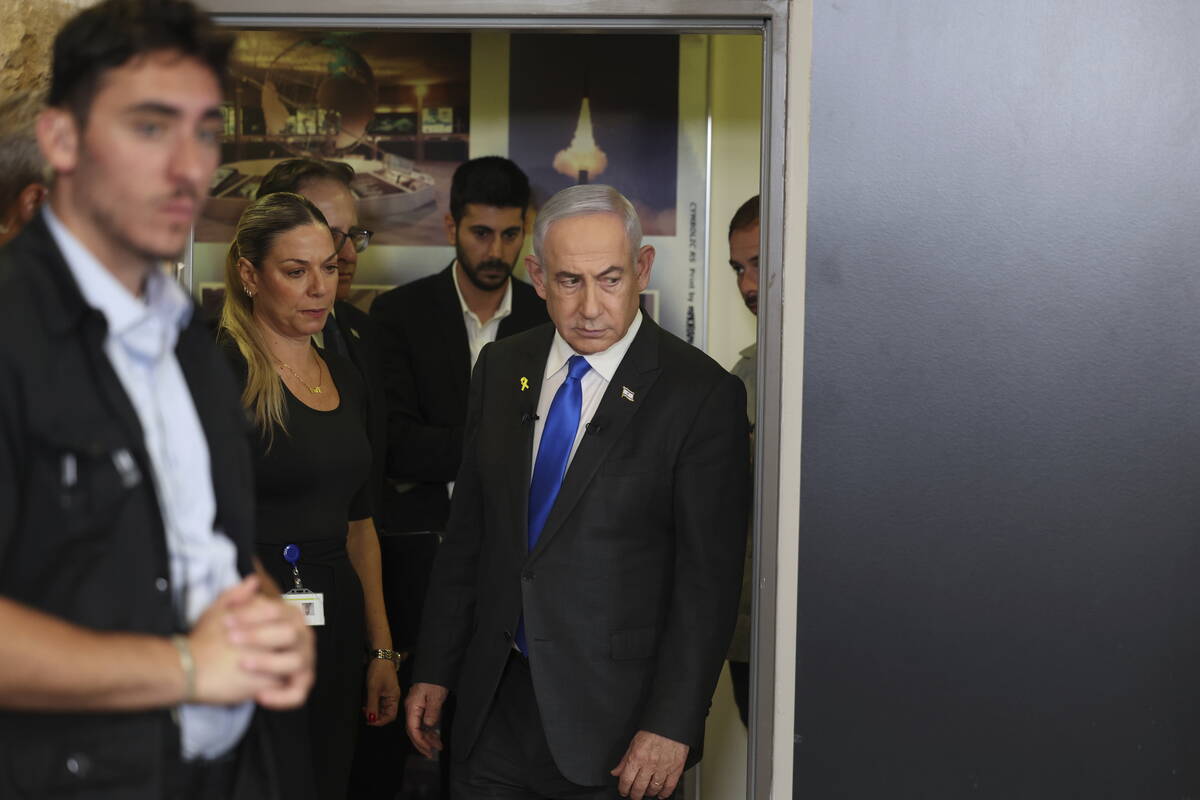 Israeli Prime Minister Benjamin Netanyahu arrives for a press conference at the Government Pres ...