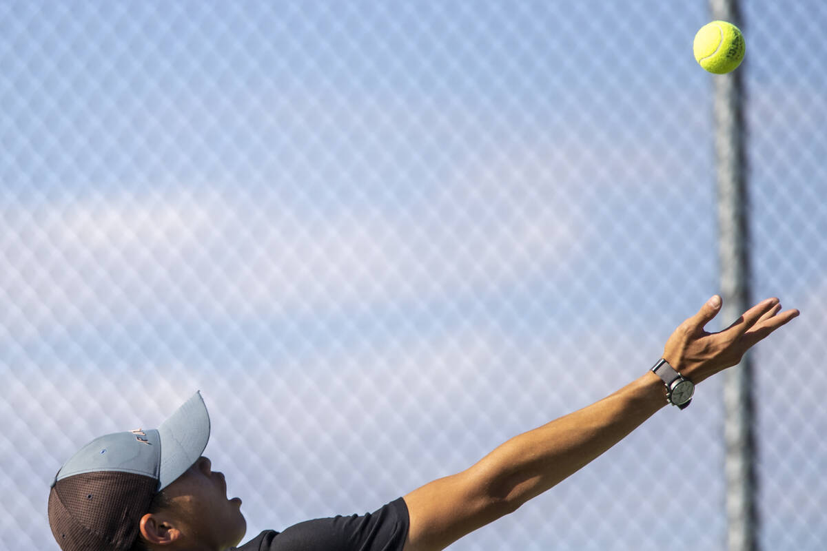 Clark senior Jayden Hong prepares to serve during the high school tennis matches against Palo V ...