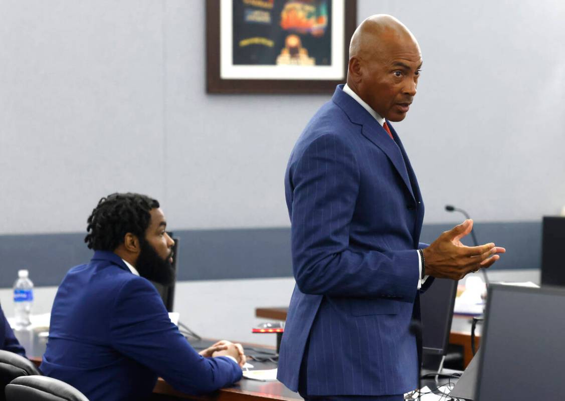 Attorney Carl Arnold, representing Deobra Redden, left, who was captured on video attacking a L ...