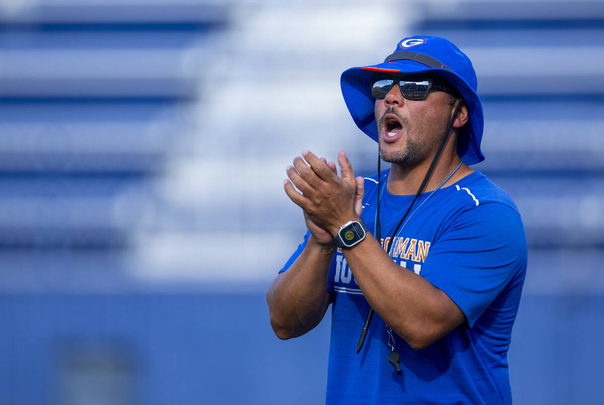 Bishop Gorman head coach Brent Browner yells to his players during football practice on Tuesday ...