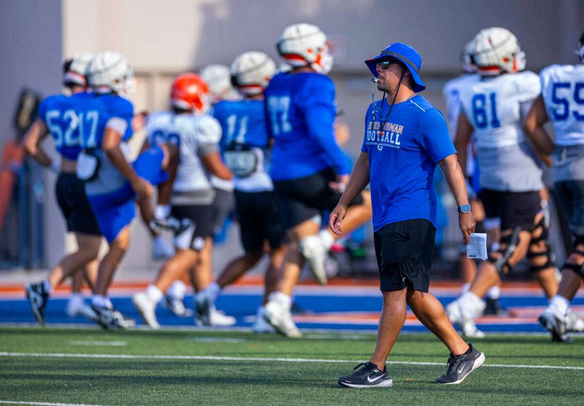 Bishop Gorman head coach Brent Browner conducts drills with his players during football practic ...