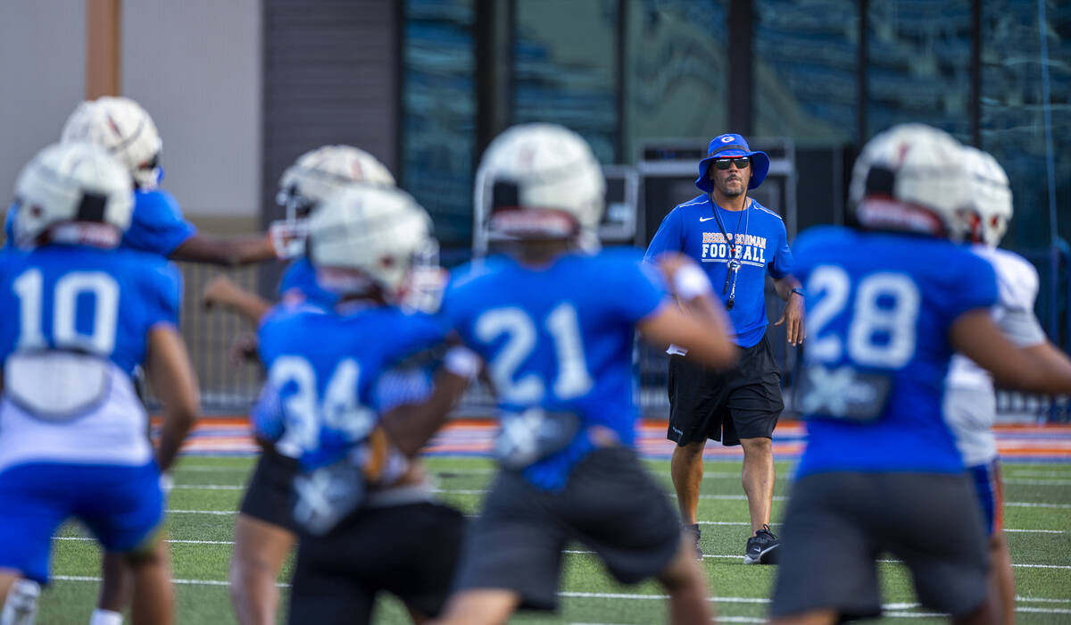 Bishop Gorman head coach Brent Browner observes his players during football practice on Tuesday ...