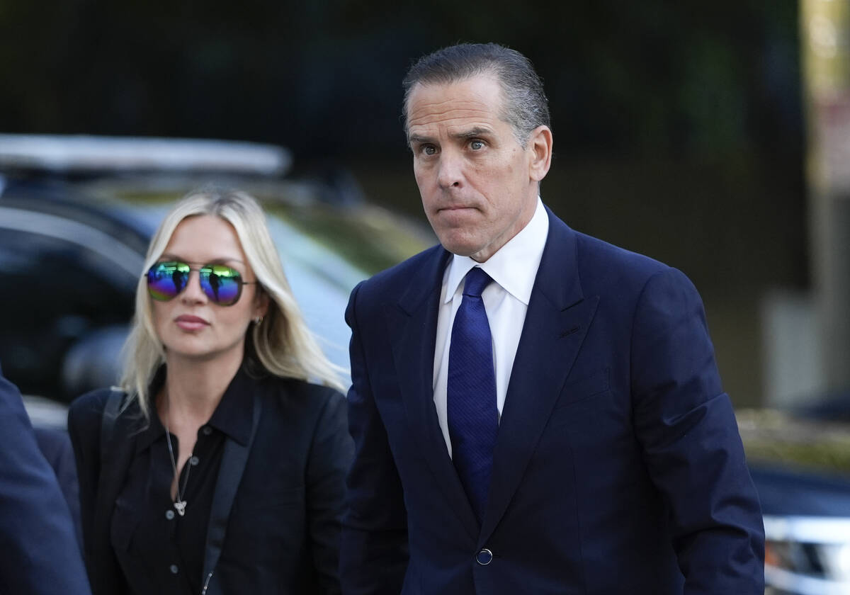 Hunter Biden, right, and his wife, Melissa Cohen Biden, arrive in federal court for jury select ...