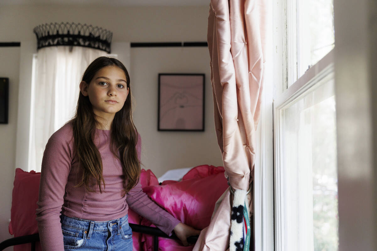 Scarlett Goddard Strahan, 11, poses for a portrait at her home on Tuesday, Aug. 20, 2024, in Sa ...