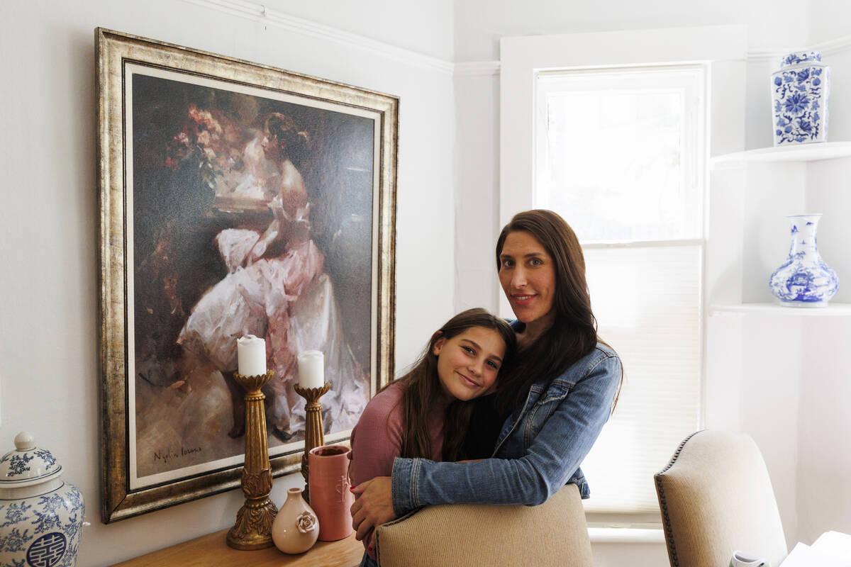 Scarlett Goddard Strahan, 11, and her mom Anna Goddard pose for a portrait at their home on Tue ...